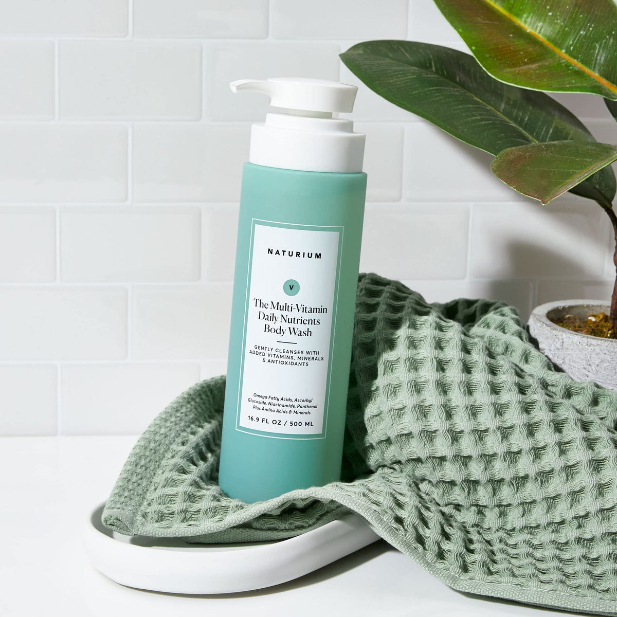 Naturium Multi-Vitamin Body Wash in a bathroom setting