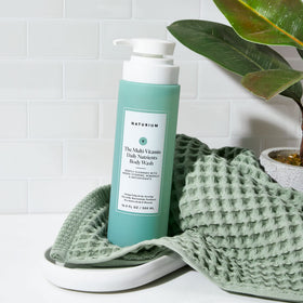 Naturium Multi-Vitamin Body Wash in a bathroom setting
