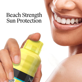 Neutrogena Beach Defense Sunscreen Spray SPF 30 8.5 oz with beach accessories