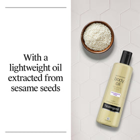 Neutrogena Body Oil Light Sesame Formula being applied to skin