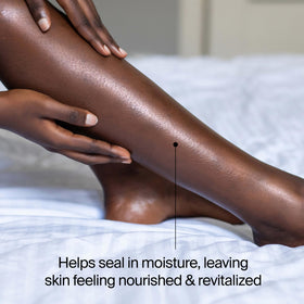 Neutrogena Body Oil Light Sesame Formula in a bath setting