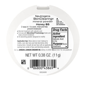 Neutrogena SkinClearing Pressed Mineral Powder Honey 85 with makeup brush