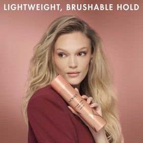 Nexxus Comb Thru Hairspray size comparison next to hand