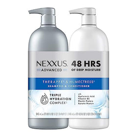 Nexxus shampoo and conditioner bottles on a bathroom shelf