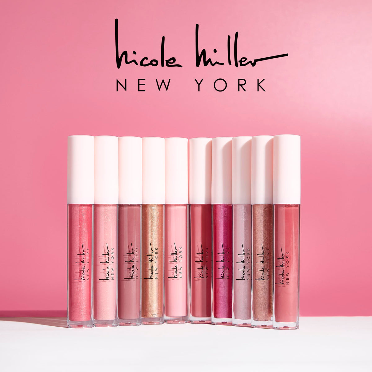 Nicole Miller Lip Gloss Collection displayed with swatches