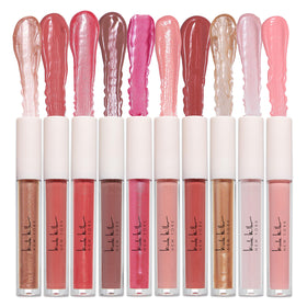 Nicole Miller Lip Gloss tubes arranged in a row