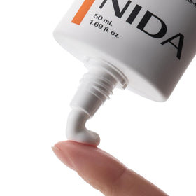 NIDA Invisible Fit Sunscreen SPF 50 bottle with cap open