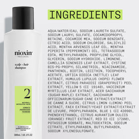Nioxin System 2 Shampoo 349g in hand with water