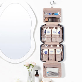NISHEL Travel Toiletry Bag hanging on a bathroom hook