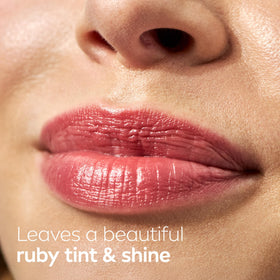 NIVEA Cherry Lip Care tinted lip balm on a wooden table
