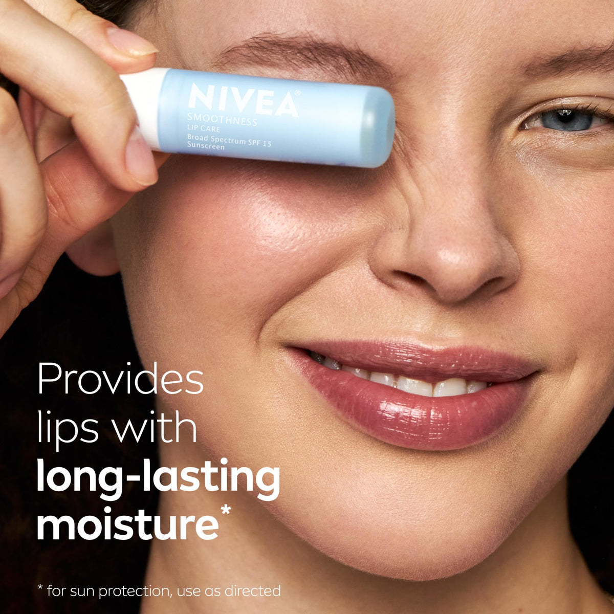 NIVEA Smoothness Lip Care SPF 15 lip balm in hand