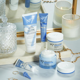 No7 Lift & Luminate skincare products on a marble surface