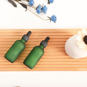 NOOEEISS dropper bottle in use for dispensing essential oils