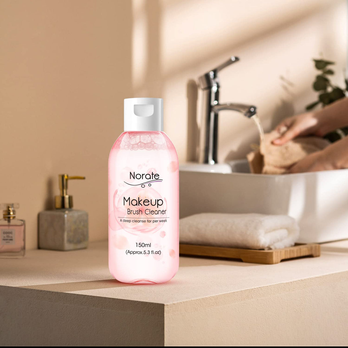 Norate Makeup Brush Cleaner on a vanity table