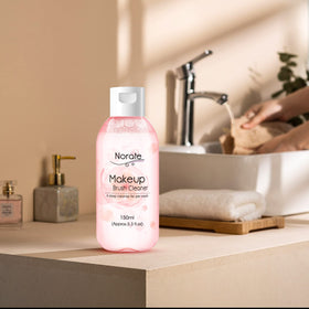 Norate Makeup Brush Cleaner on a vanity table