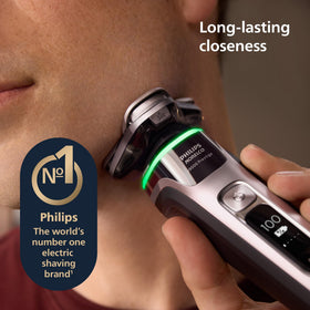 Norelco i9000 Prestige Electric Shaver side view with charging stand