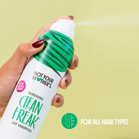 Not Your Mother's Jumbo Dry Shampoo with a hand holding it
