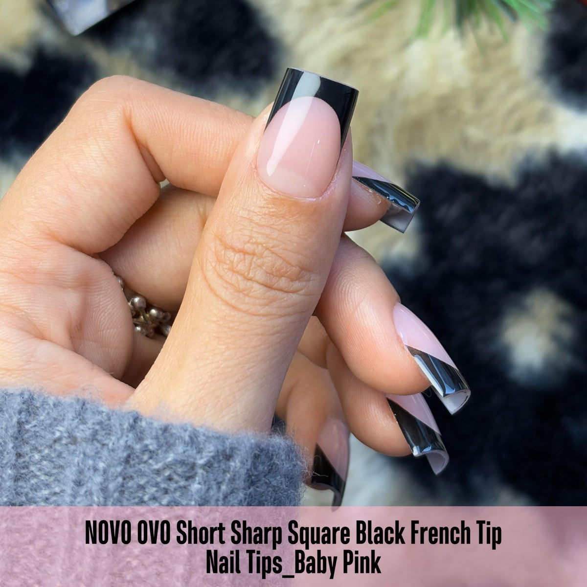 NOVO OVO nail tips applied on nails showcasing black French tips