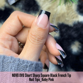 NOVO OVO nail tips applied on nails showcasing black French tips