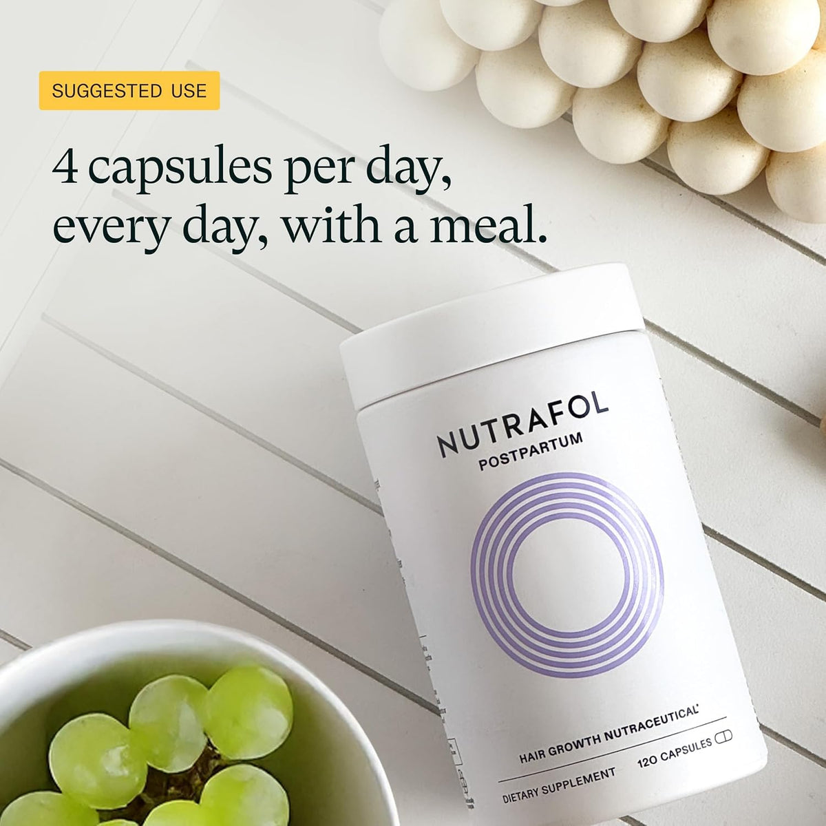 Nutrafol Postpartum Hair Growth Supplements in a bathroom setting