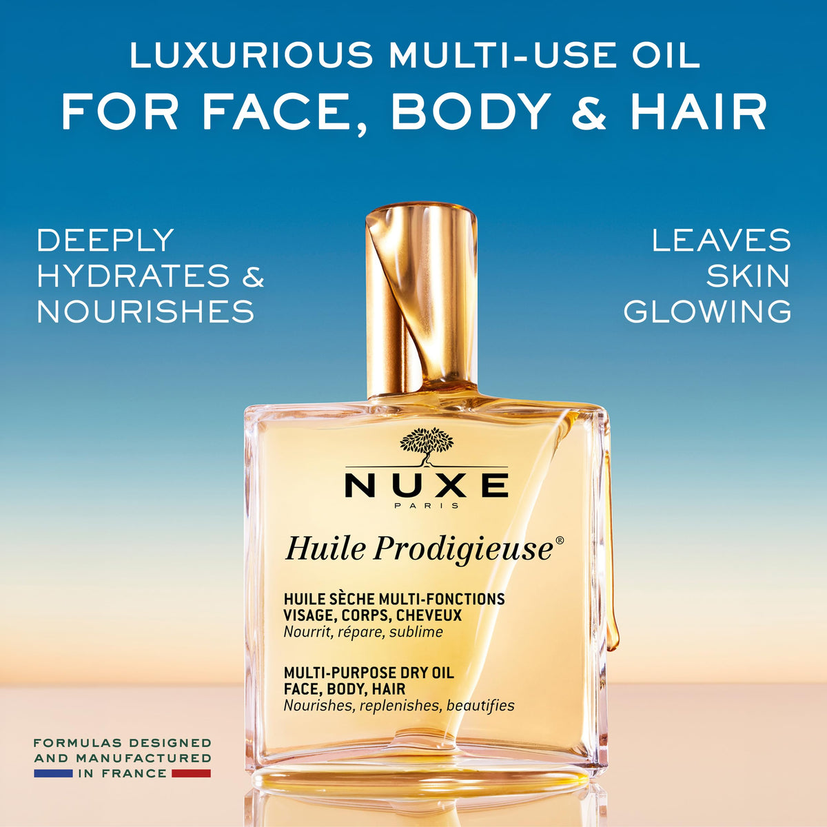 NUXE Huile Prodigieuse bottle with botanical oils background