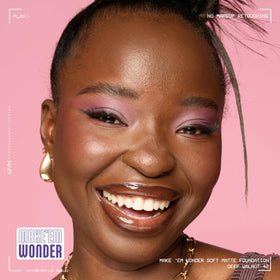 NYX Make 'Em Wonder Liquid Foundation 42 Deep Walnut with makeup tools