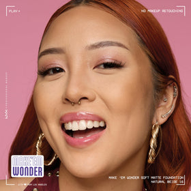 NYX Make 'Em Wonder Liquid Foundation displayed with makeup tools