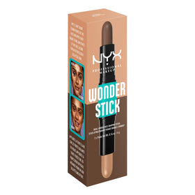NYX Wonder Stick in Medium Tan on a vanity with makeup brushes