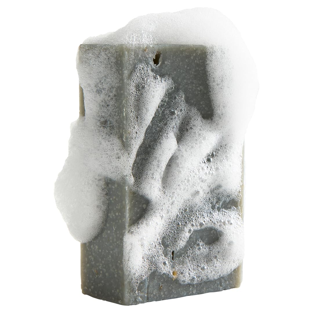 Oatmeal Shea soap bar from Crate 61 Organics on a wooden soap dish