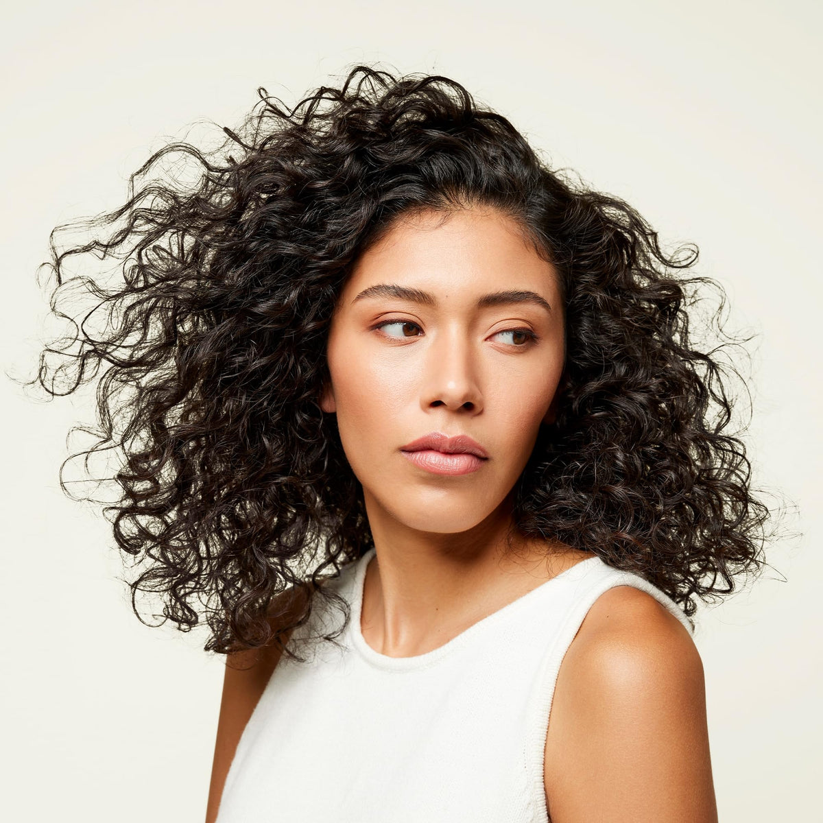 Odele Clarifying Shampoo on a bathroom shelf