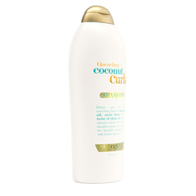 OGX Quenching + Coconut Curls Shampoo on bathroom shelf