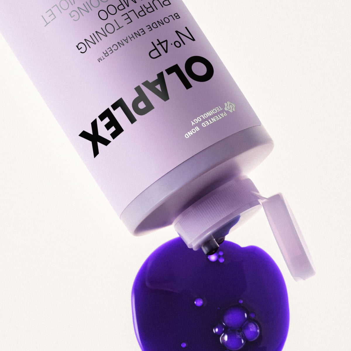 Olaplex N°.4P Blonde support Purple Shampoo with a lathered hand