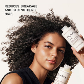 Olaplex shampoo and conditioner in a bathroom setting