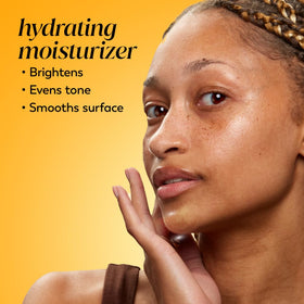 Olay moisturizer texture on a fingertip
