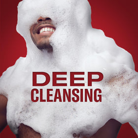 Old Spice Raptorstrike Body Wash in hand under flowing water