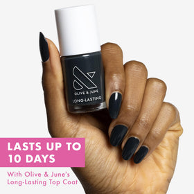 Olive & June nail polish bottle with wide fan brush