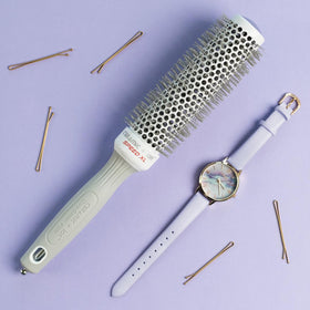 Olivia Garden Ceramic + Ion Speed XL Round Hair Brush on a vanity