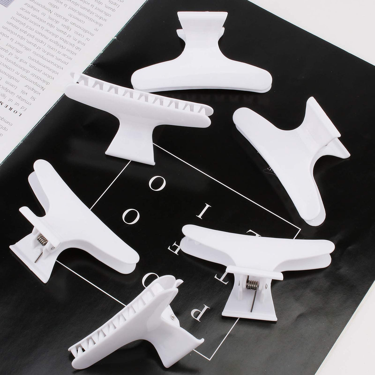 Ondder hair clips displayed with hair styling tools