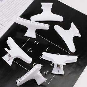 Ondder hair clips displayed with hair styling tools