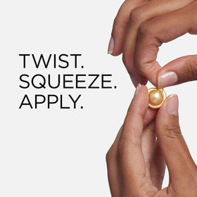 Open capsule of Elizabeth Arden serum showing clear liquid