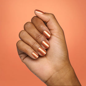 OPI Goodie as Gold nail polish with holiday decorations