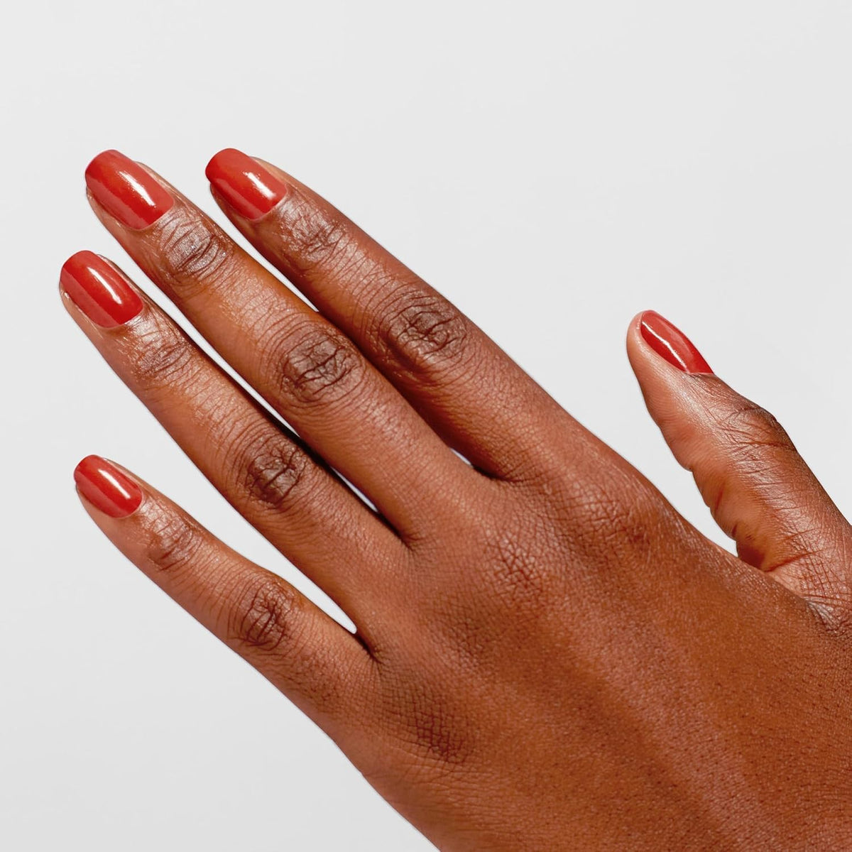 OPI Infinite Shine Nail Polish Knock 'Em Red application process