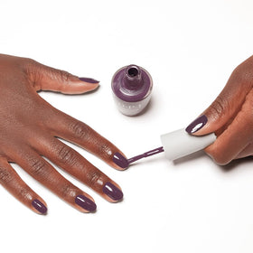 OPI Nature Strong Dark Purple Crème Nail Polish in lifestyle setting