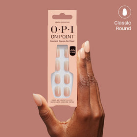 OPI On Point Peach Smoochie nails displayed on a table