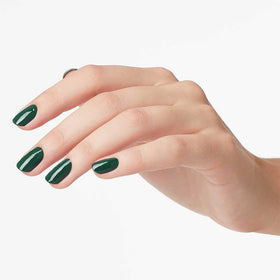 OPI Stay Off the Lawn!! nail polish with backdrop of nail art tools