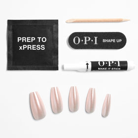 OPI xPRESS/ON Throw Me a Kiss nails in a stylish setting
