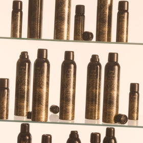 ORIBE Dry Texturizing Spray on a vanity