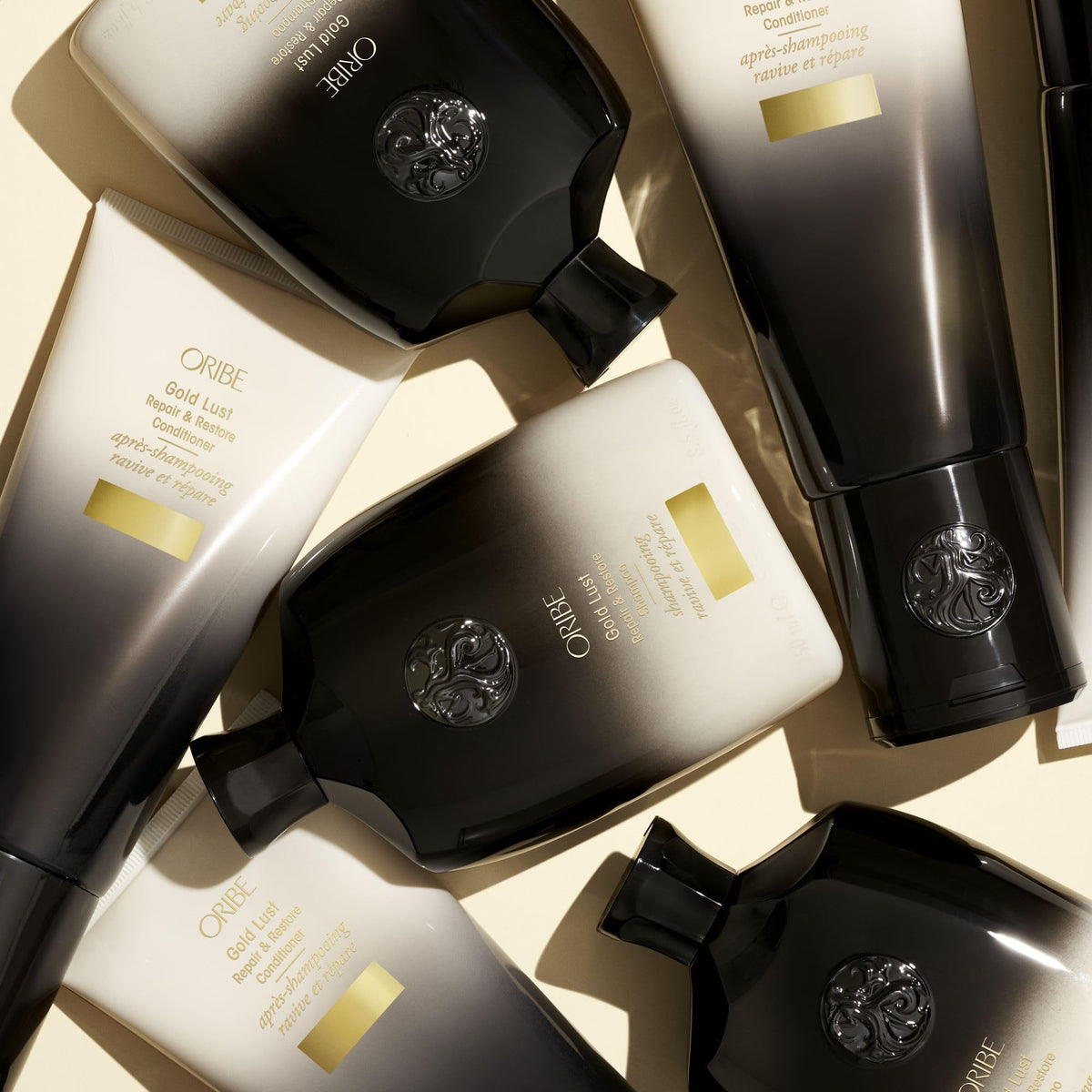 ORIBE Gold Lust Shampoo beside hair care accessories
