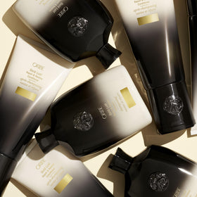 ORIBE Gold Lust Shampoo beside hair care accessories