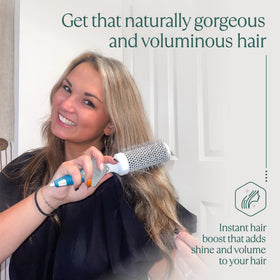 Osensia round brush displayed with hair care products